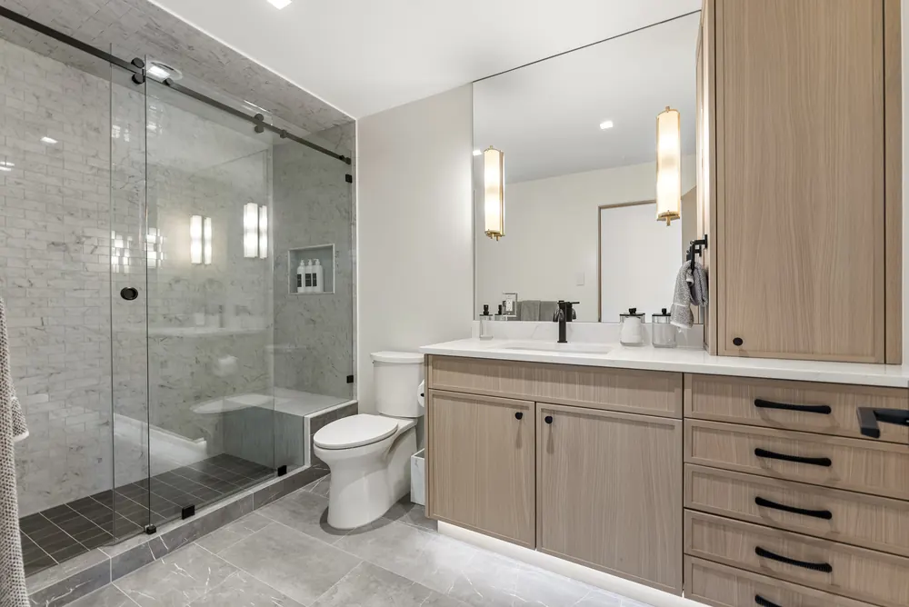 Large-format marble-look walls, bench and niche, Cherry Hills Village residence