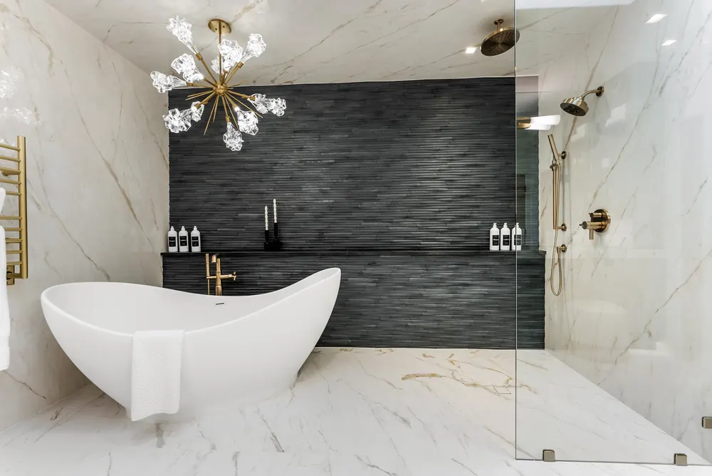 Black linear stone feature wall, marble-look floors and walls, Cherry Hills Village residence