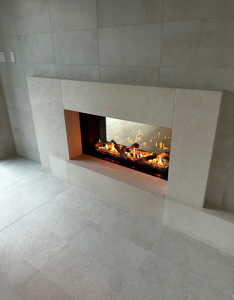 Linear fireplace: large-format porcelain surround and floor