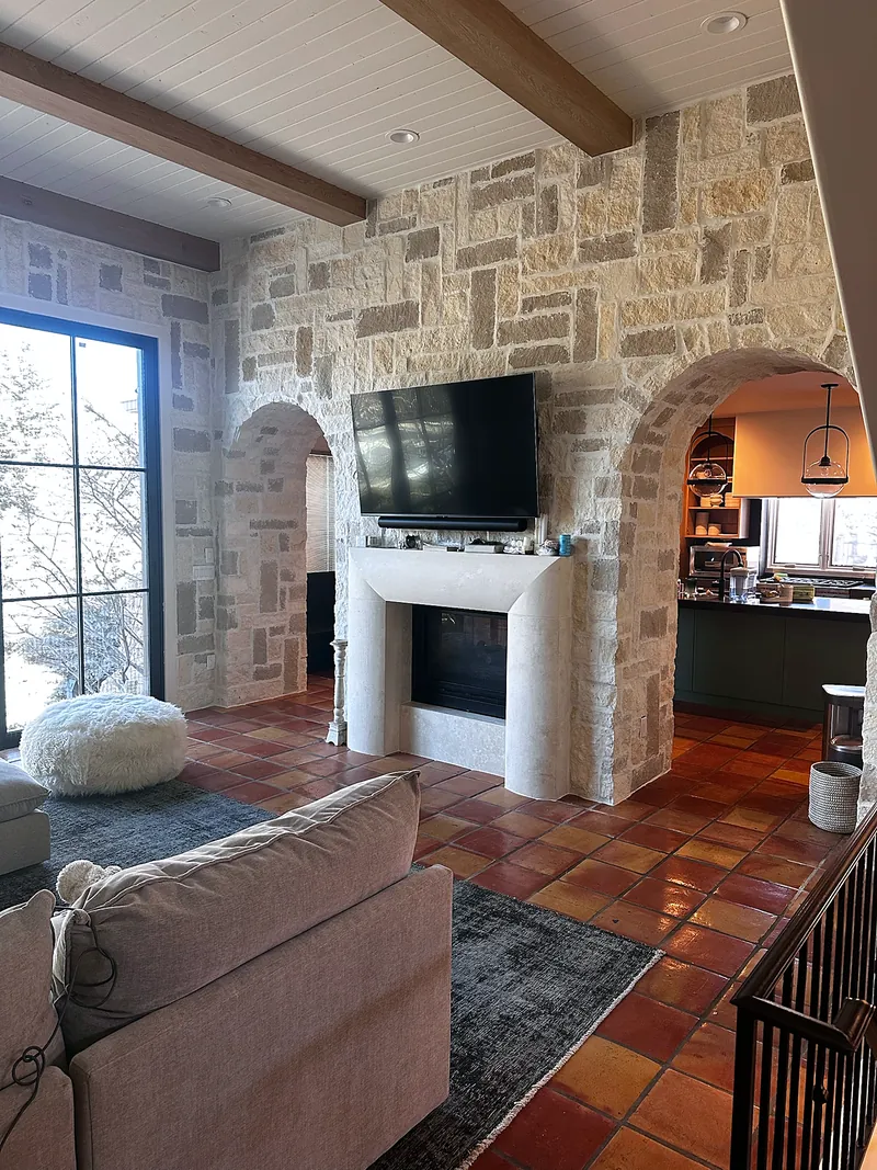 Stone archways: hand-set natural stone walls and fireplace